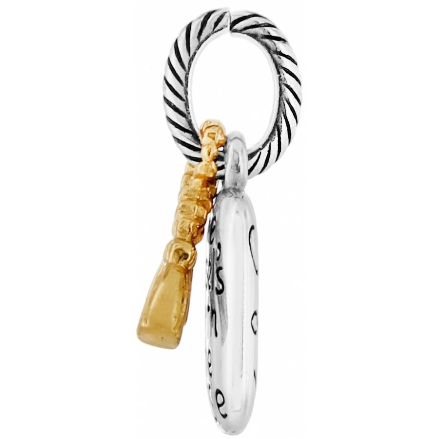 Brighton charm with two-tone silver and gold-tone finish, twisted rope ring, and dangling accents on a white background