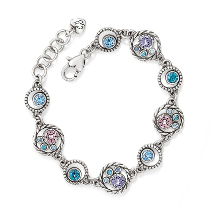 Brighton silver-plated bracelet with circular links featuring blue, pink, and purple crystals on a white background