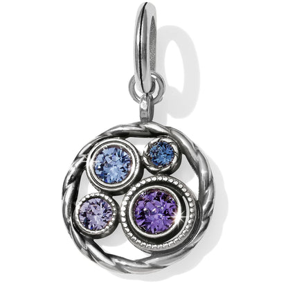 Brighton charm with blue and purple crystals in silver-plated braided circular frame on a white background