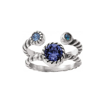 Brighton silver-plated ring with three blue crystals in twisted rope band setting on a white background