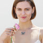 Model wearing a Brighton silver-plated butterfly pendant necklace with crystal accents and coordinating Brighton accessories