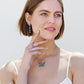 Model wearing a Brighton silver-plated butterfly pendant necklace with crystal accents and coordinating Brighton accessories
