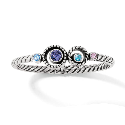 Brighton silver-plated twisted rope bangle bracelet with purple, blue, and pink crystal accents on a white background