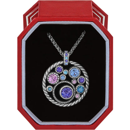 Brighton pendant necklace with silver-plated circular design and purple, blue, and pink crystals in red gift box