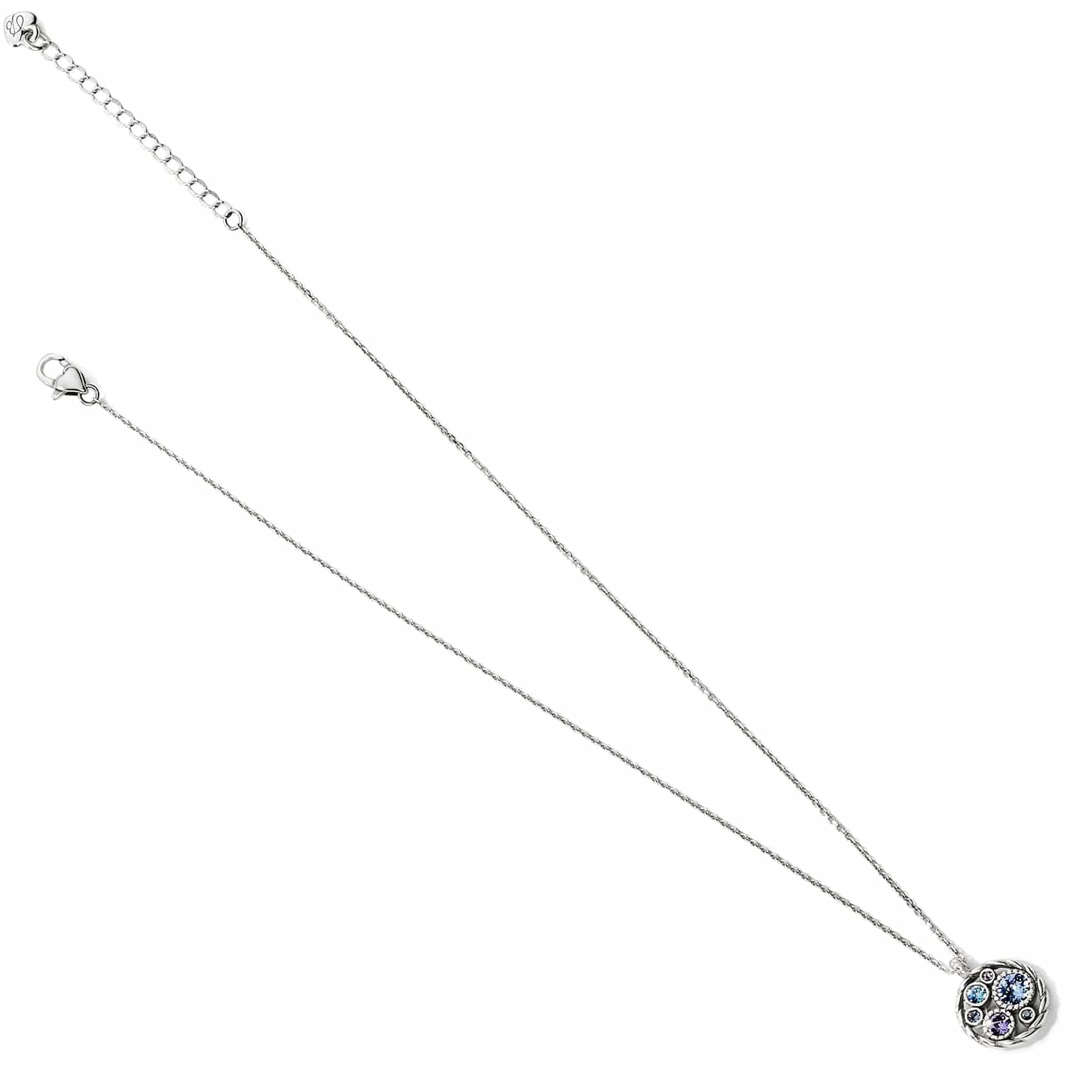 Brighton pendant necklace with silver-plated chain and round pendant featuring blue and clear crystals on a white background