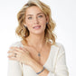 Model wearing a Brighton silver-plated key pendant necklace with purple crystals and coordinating Brighton accessories