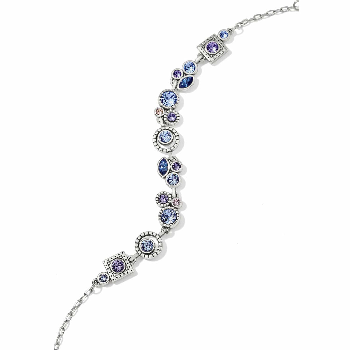 Brighton bracelet with blue, purple, and pink crystals in round and square silver-plated stations on a white background