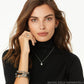 Model wearing a Brighton silver-plated teardrop pendant necklace with coordinating Brighton accessories including earrings, ring, and bracelets
