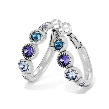Brighton silver-plated hoop earrings with blue and purple crystals in beaded bezel settings on a white background