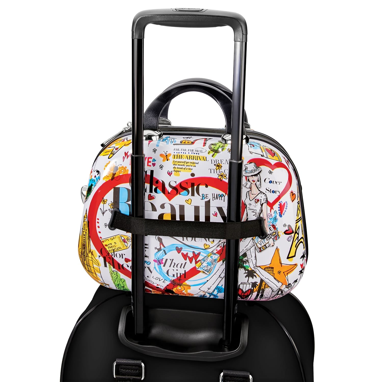 Brighton travel bag with colorful graphic print featuring hearts and illustrations, attached to black luggage handle on a white background