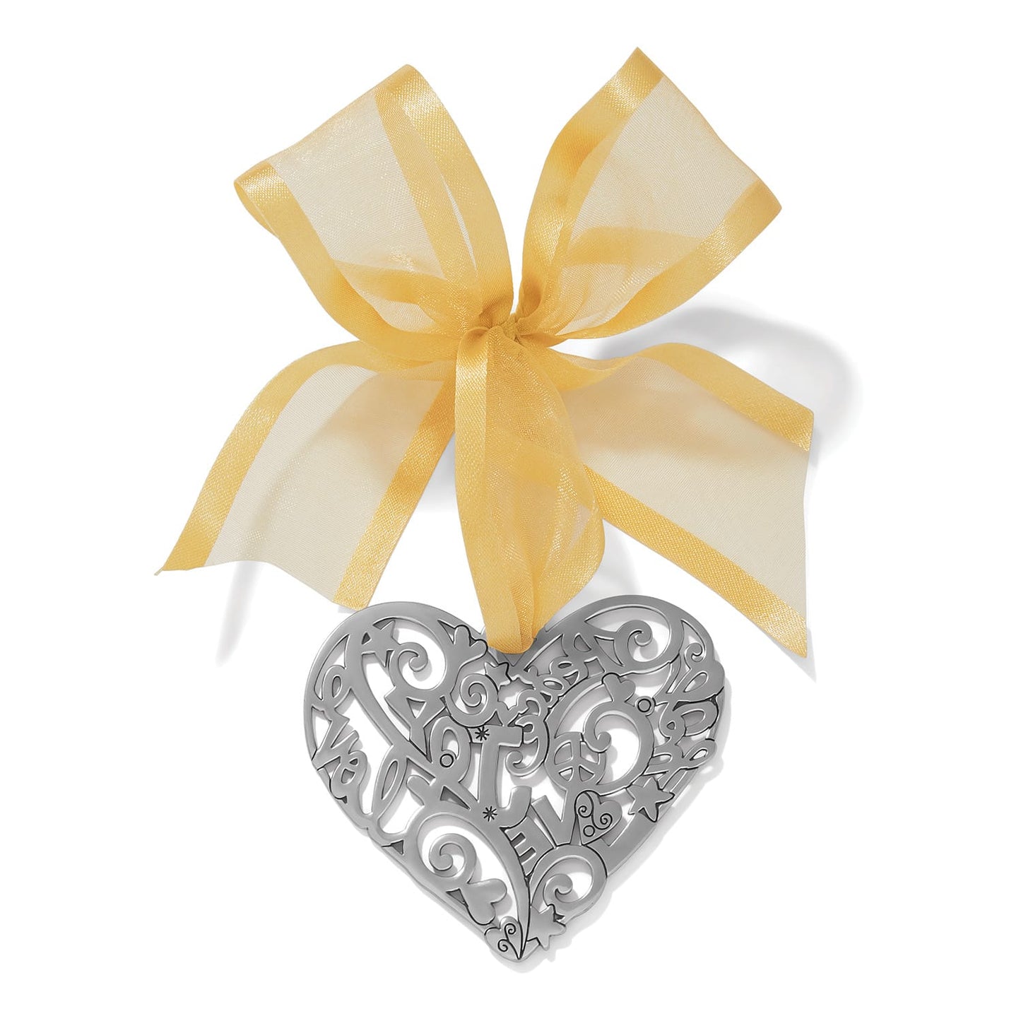 Brighton silver-plated heart ornament with openwork scroll design and sheer gold ribbon bow on a white background