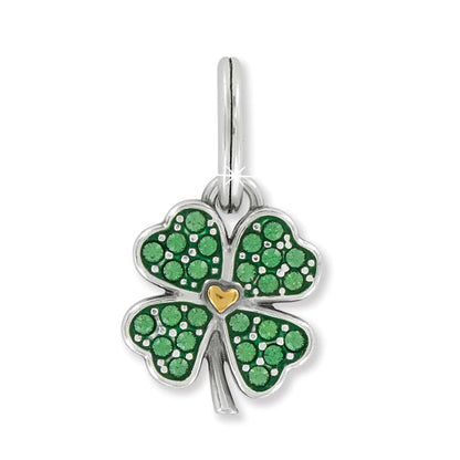 Brighton four-leaf clover charm with green crystals, enamel detail, gold heart center, and silver-plated finish on a white background