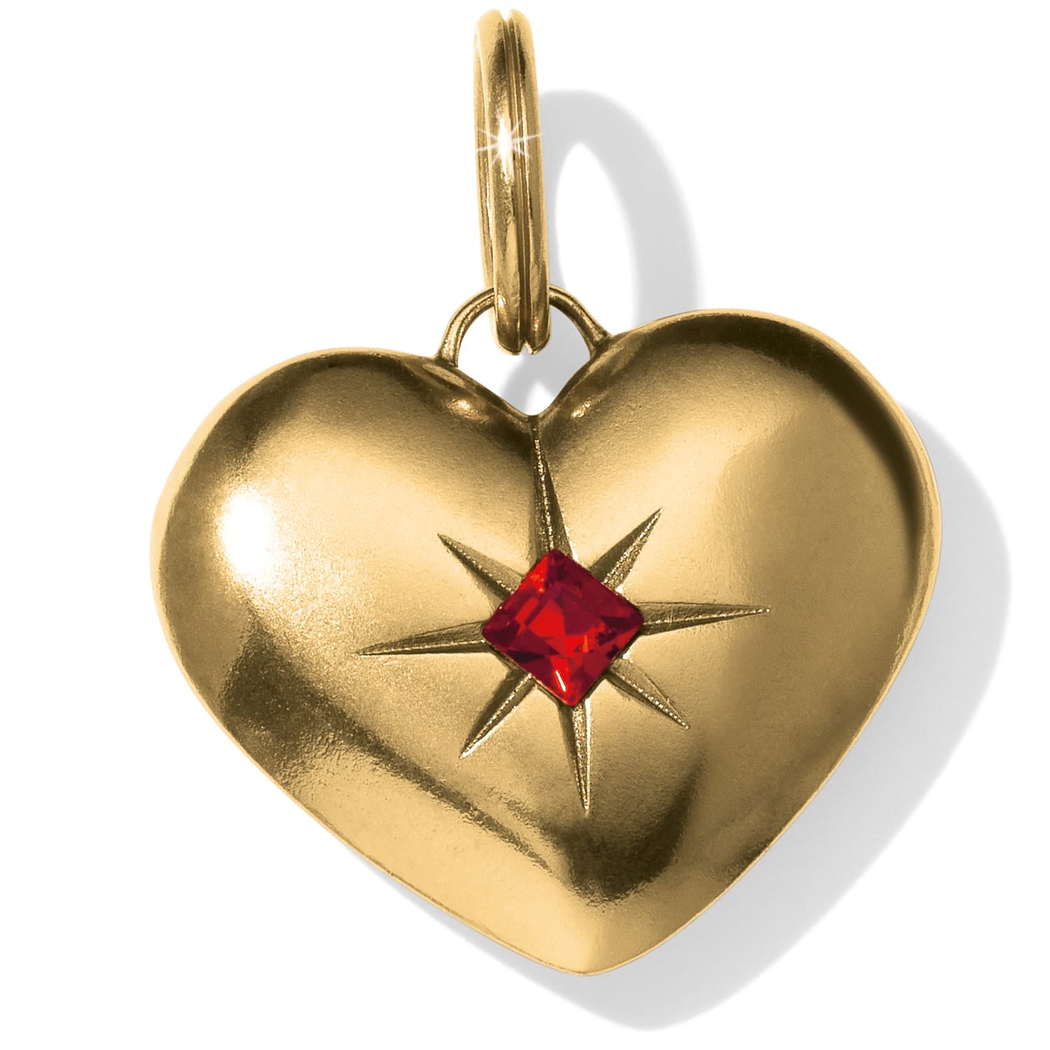 Brighton heart charm with gold-plated finish and red crystal starburst accent on a white background