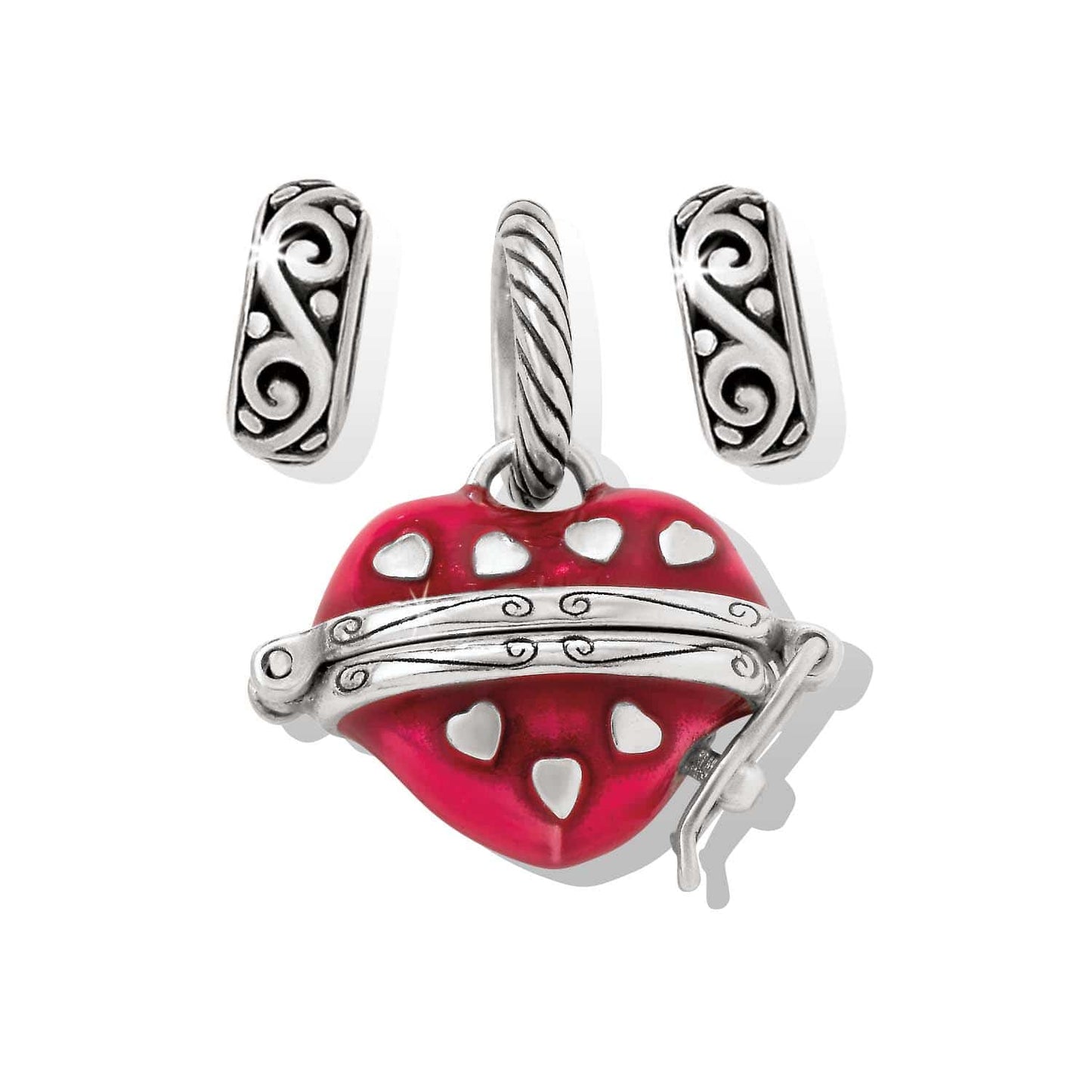 Brighton red enamel heart charm with silver-plated scrollwork band and two silver-plated spacer beads on a white background