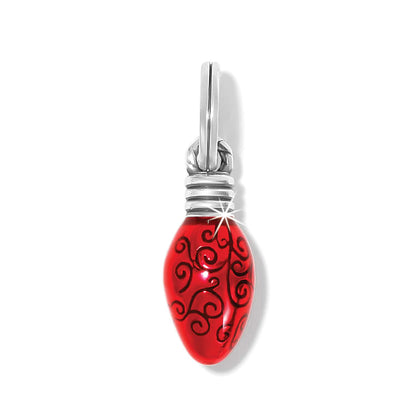 Brighton charm shaped like a red enamel Christmas light bulb with swirl pattern and silver-plated cap on a white background