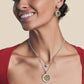 Model smiling wearing Holiday Joy French Wire Earrings & Necklace