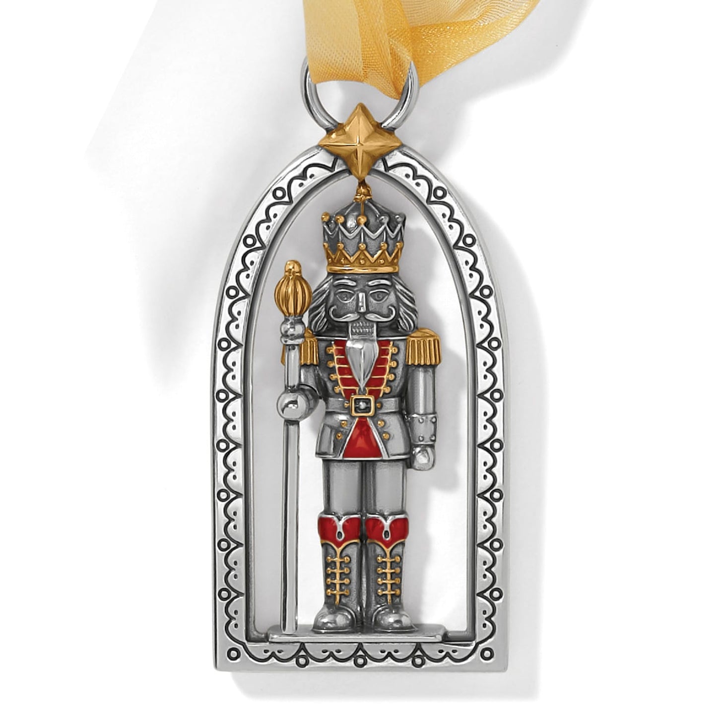 Brighton nutcracker ornament with silver and gold two-tone finish, red enamel accents, and gold ribbon on a white background