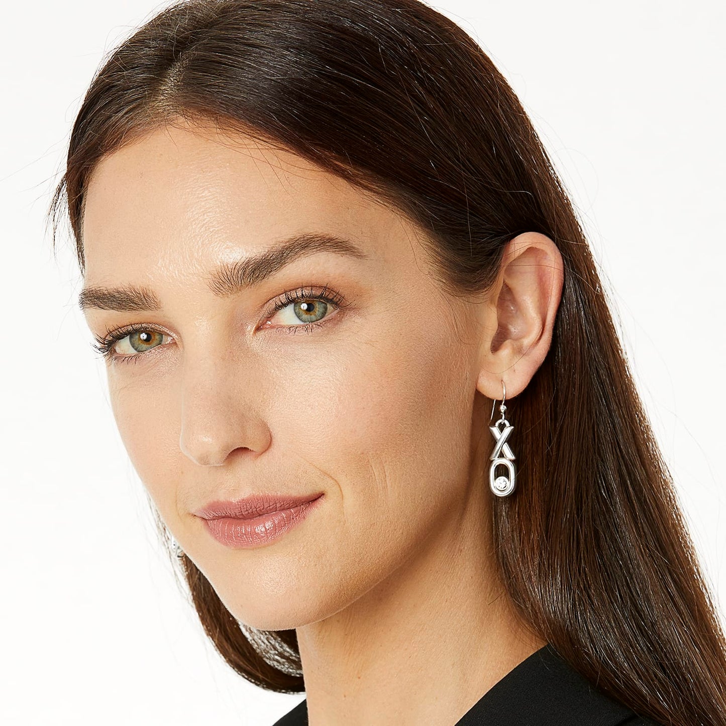 Model wearing a Brighton silver-plated drop earring with XO design and crystal accent