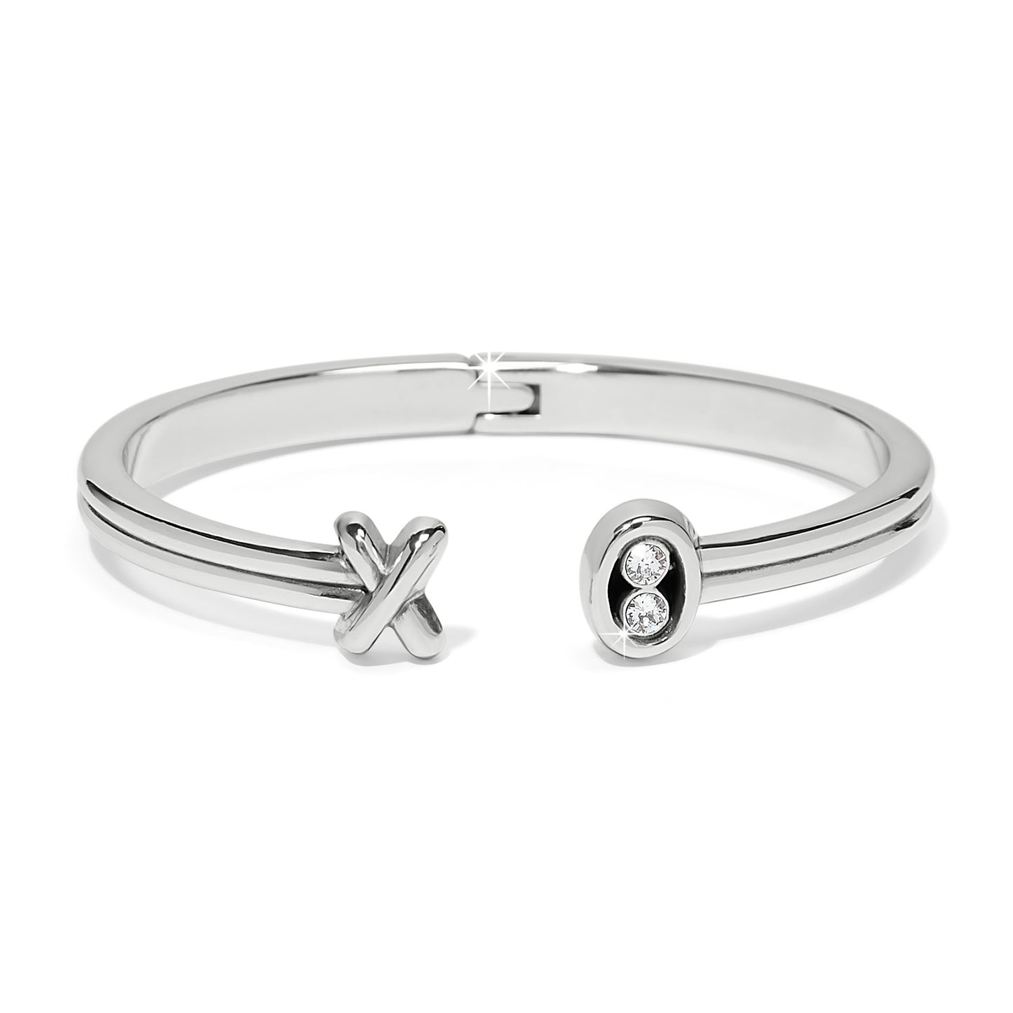 Brighton hinged cuff bracelet with silver-plated finish, X motif, and oval crystal accent end on a white background