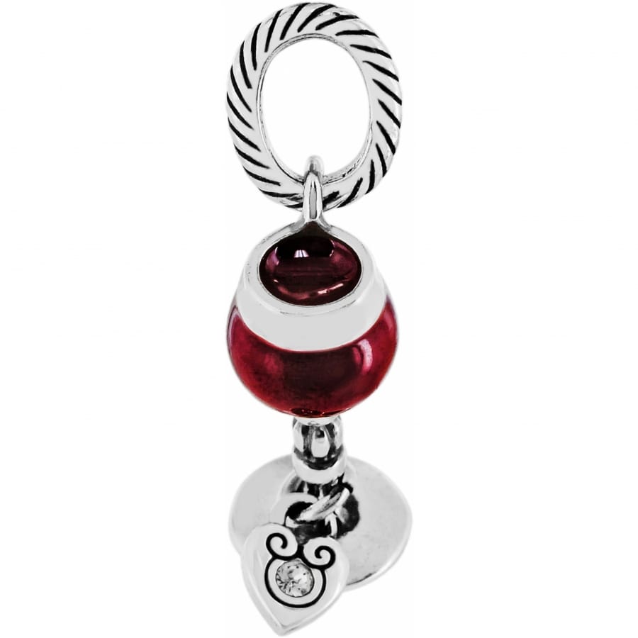 Brighton charm with red enamel bead, silver-tone cable ring, and dangling heart with crystal accent on a white background