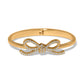 Brighton hinged bangle bracelet with gold-plated finish and crystal-encrusted bow centerpiece on a white background