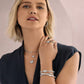 Model wearing Brighton silver-plated layered necklaces with crystal heart pendants and coordinating Brighton accessories