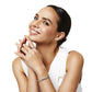 Model wearing a Brighton silver-plated bangle bracelet with crystal accents, coordinating ring, and crystal drop earrings