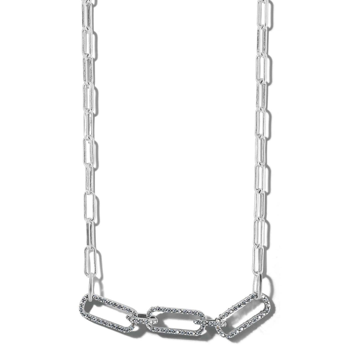 Brighton silver-plated paperclip chain necklace with crystal-encrusted linked stations at the center on a white background