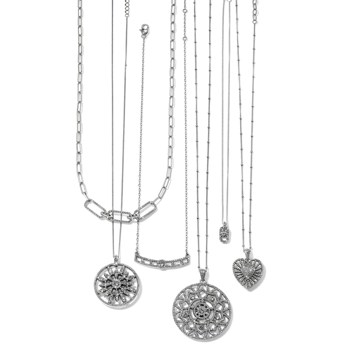 Brighton silver-plated necklaces with crystal pendants featuring floral medallion, bar, and heart designs on a white background