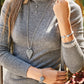 Model wearing a Brighton silver-plated heart pendant necklace with crystals and coordinating Brighton accessories