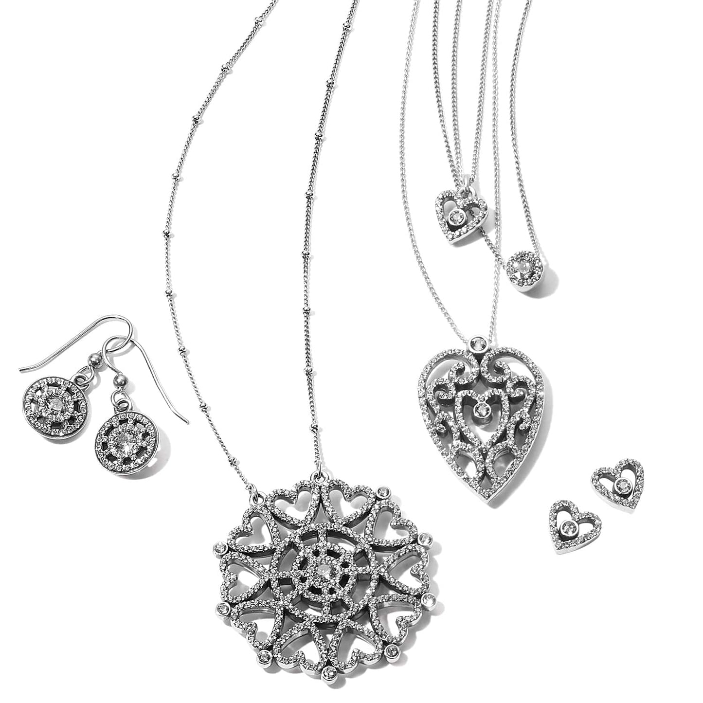 Brighton silver-plated jewelry set styled with heart pendant necklaces and matching earrings featuring crystal accents