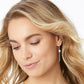 Model wearing a Brighton silver-plated drop earring with round crystal accent and pavé crystal bar dangle
