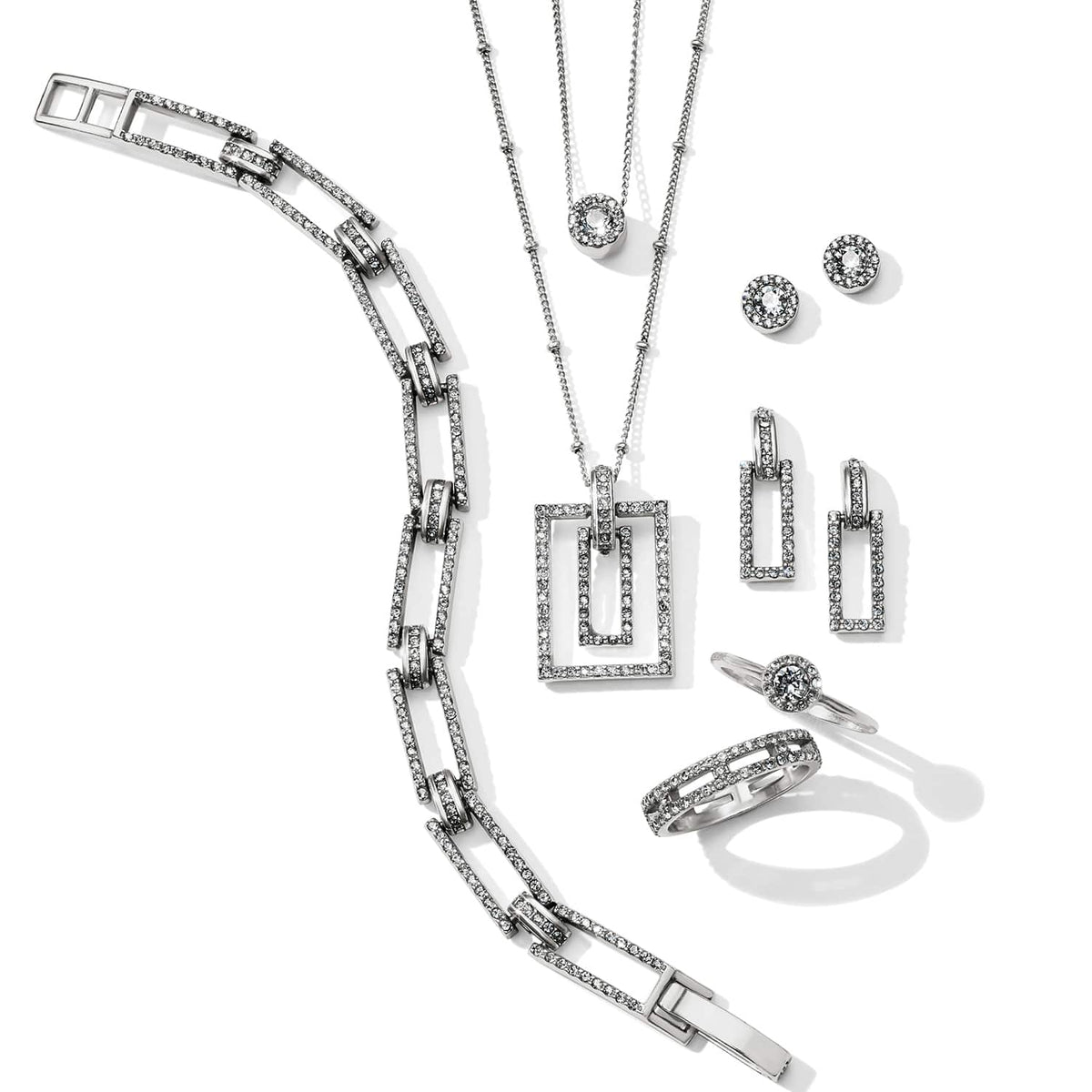 Brighton silver-plated jewelry set styled with matching bracelet, necklaces, earrings, and rings featuring crystal-accented rectangular links