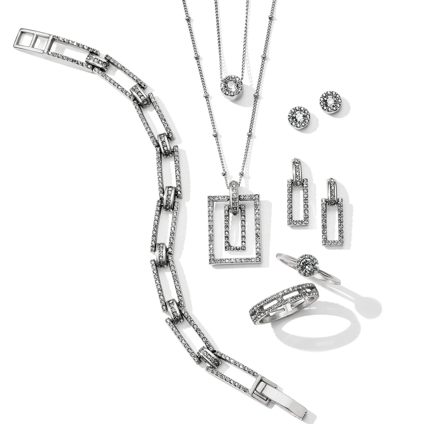 Brighton silver-plated jewelry set styled with matching bracelet, necklaces, earrings, and rings featuring crystal-accented rectangular links