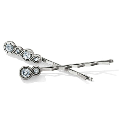 Brighton silver-plated hair pins with circular crystal accents in graduated sizes on a white background