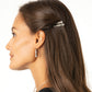 Model wearing Brighton silver-plated crystal drop earrings paired with coordinating silver-plated crystal hair pins