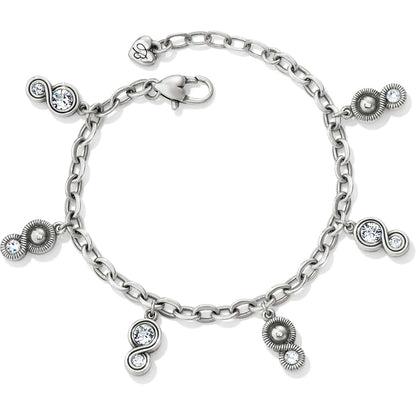 Brighton silver-plated charm bracelet with dangling crystal and textured swirl charms and lobster clasp on a white background