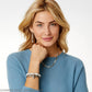Model wearing Brighton silver-plated drop earrings with crystal accents and coordinating Brighton necklace and charm bracelets