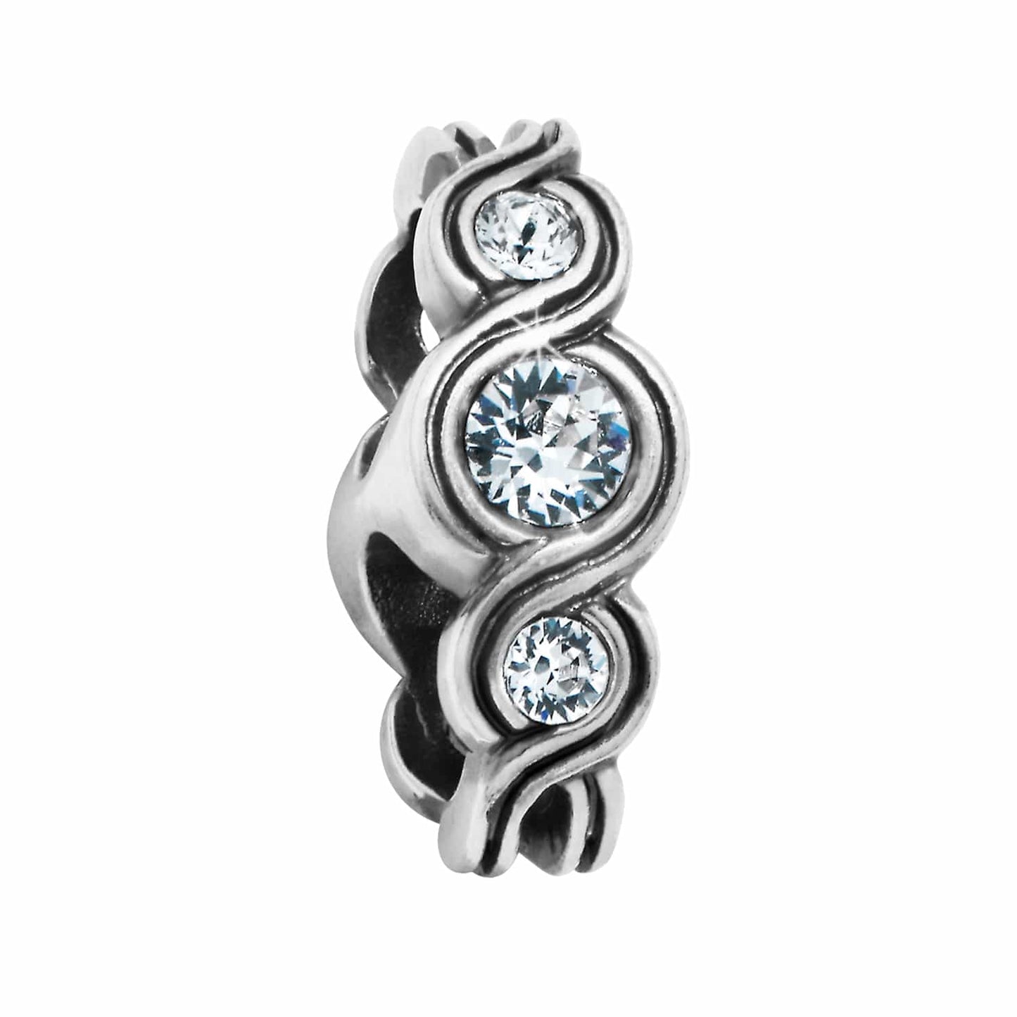 Brighton spacer charm with three round crystals set in silver-tone swirling scrollwork design on a white background