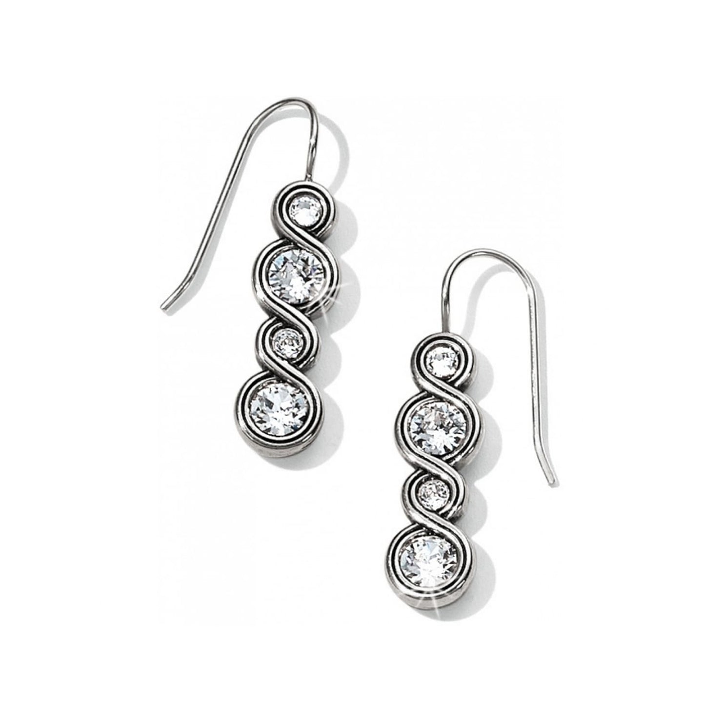 Brighton silver-plated drop earrings with alternating small and large crystals in a twisting design on a white background