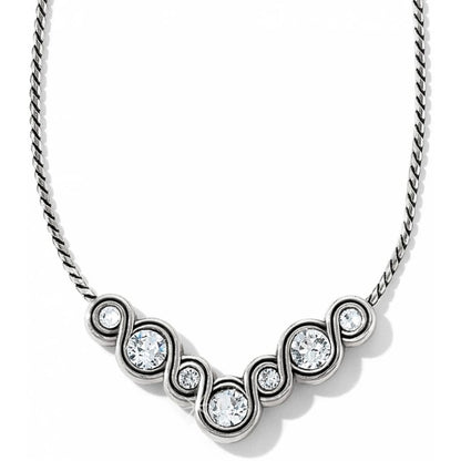 Brighton necklace with silver-plated swirl pendant and round crystal accents on a delicate chain on a white background