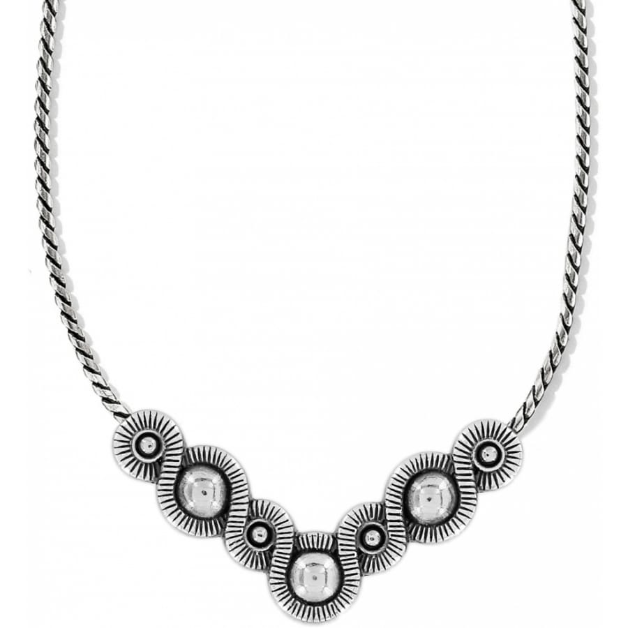 Brighton necklace with silver-plated circular medallions featuring domed centers and radiating textured details on a white background