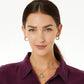 Model wearing Brighton silver-plated hoop earrings with crystal accents paired with a silver-plated heart pendant necklace