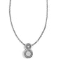 Brighton pendant necklace with silver-plated figure-eight design featuring concentric circle detailing on a white background