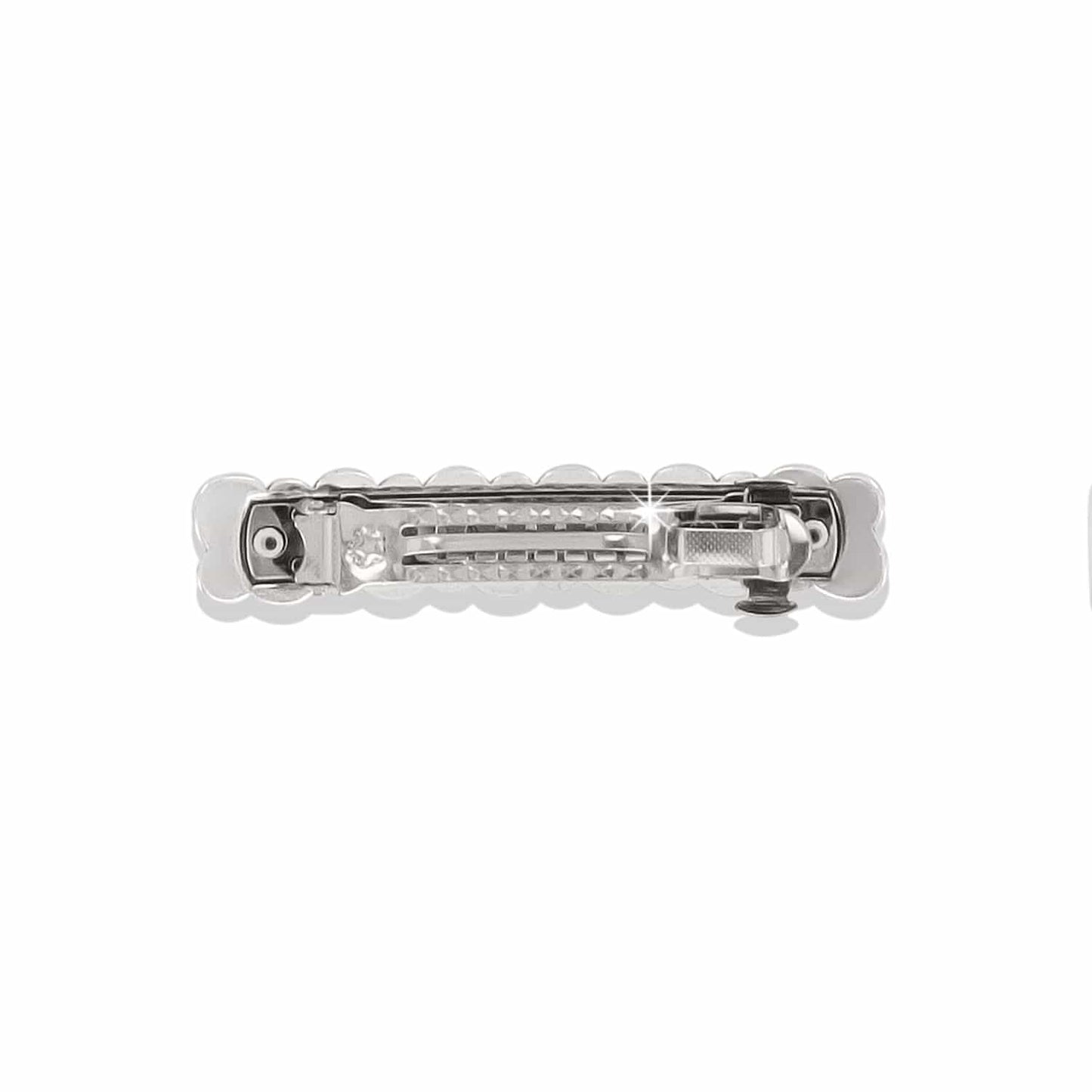 Brighton hair barrette shown from the back with silver-plated clasp mechanism and scalloped edges on a white background