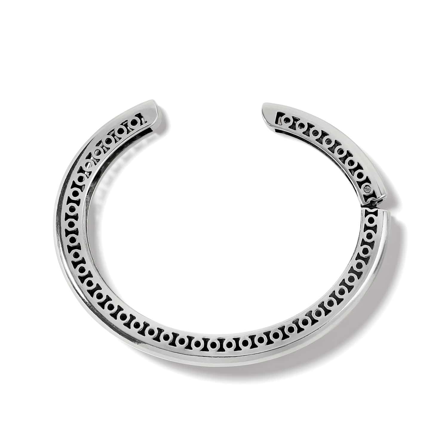 Brighton hinged cuff bracelet shown from the back with silver-plated openwork frame and dot detailing on a white background