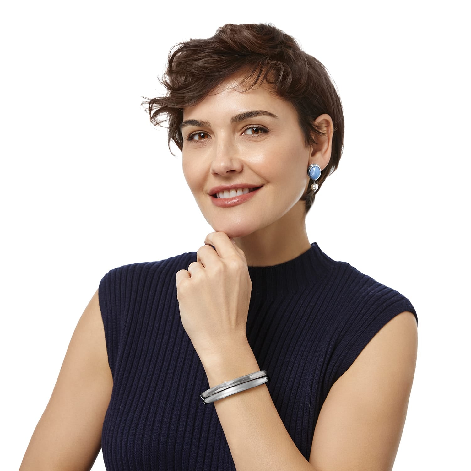 Model wearing Brighton blue stone drop earrings paired with a silver-plated hammered bangle bracelet