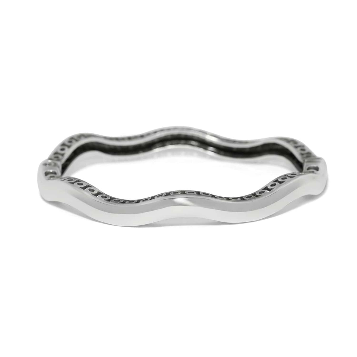 Brighton bangle bracelet with silver-plated wavy design and decorative openwork inner detailing on a white background