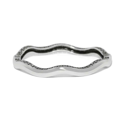 Brighton bangle bracelet with silver-plated wavy design and decorative openwork inner detailing on a white background
