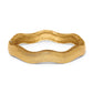 Brighton bangle bracelet with wavy sculpted design and brushed gold-tone finish with scrollwork edge on a white background